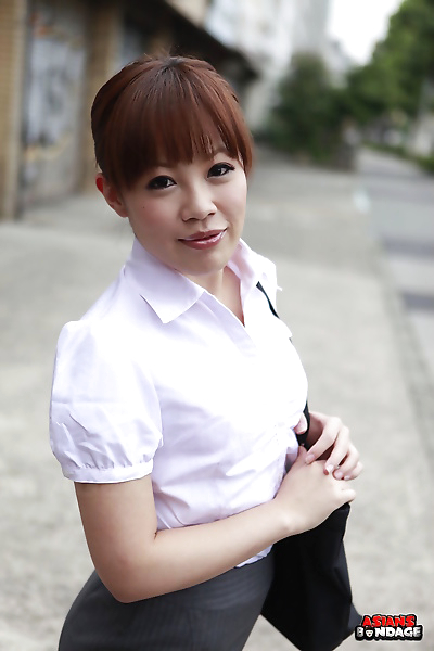 Beautiful Japanese woman Ai Yoneyama posing in public in tight pencil skirt
